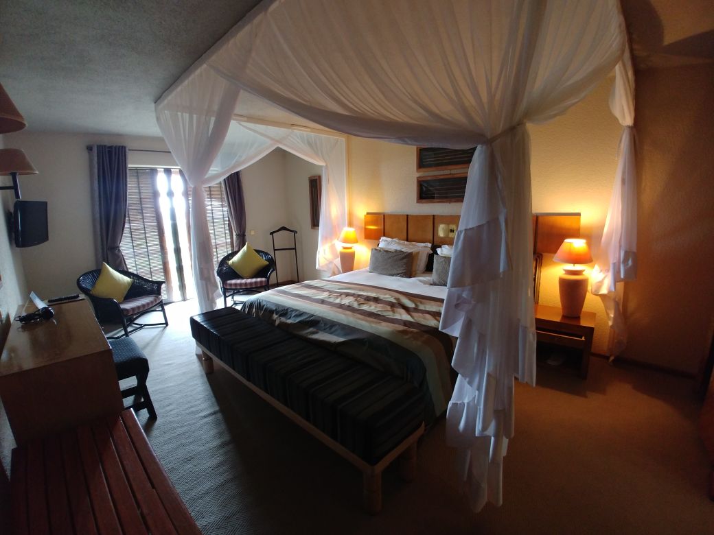 Elephant Hills Deluxe room bed